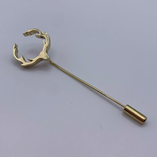 Brass stick pin topped with antlers and finished with end cap